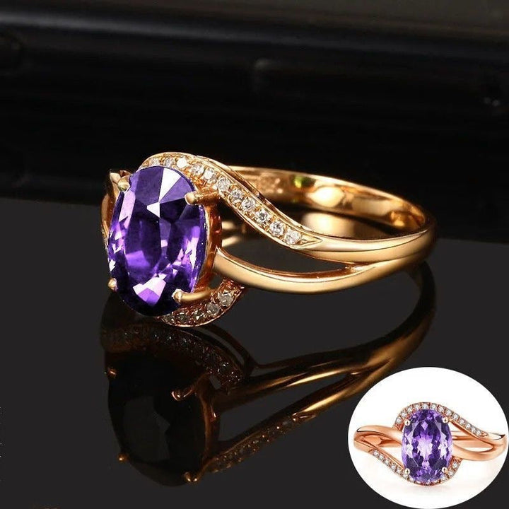 Gold ring with garnet crystal and zirconia